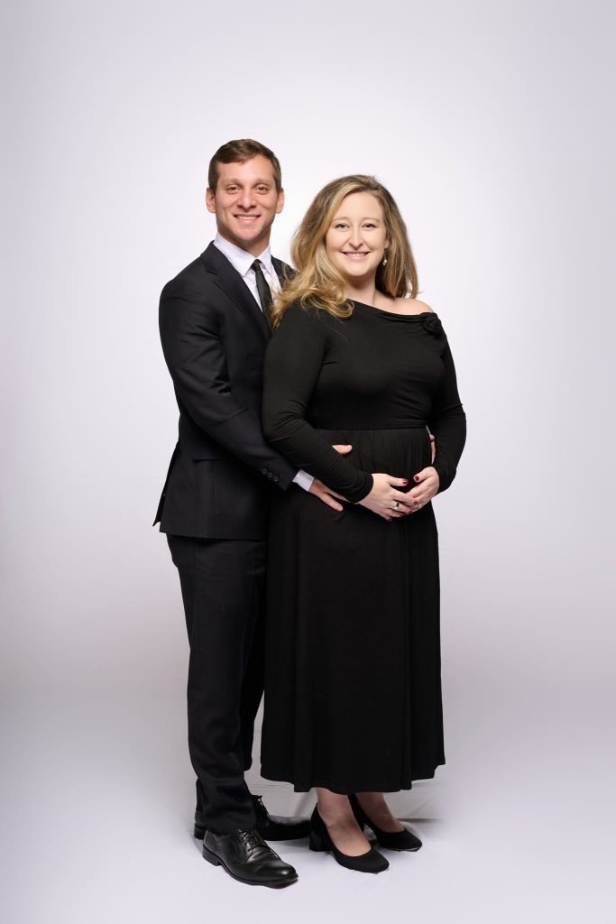 Wedding guest portrait on a white seamless backdrop at Andrea and Hugh's wedding