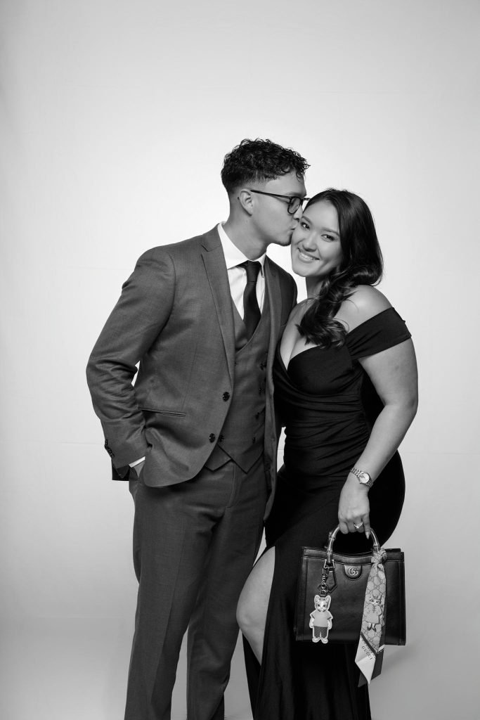 Wedding guest portrait on a white seamless backdrop at Andrea and Hugh's wedding (black and white)
