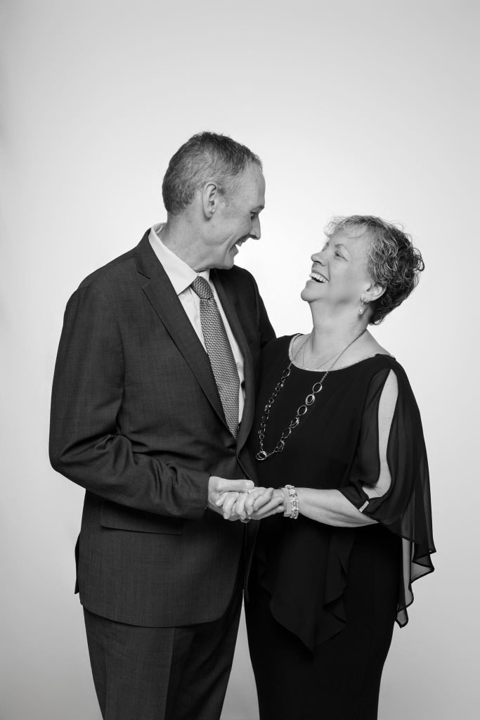 Wedding guest portrait on a white seamless backdrop at Andrea and Hugh's wedding (black and white)