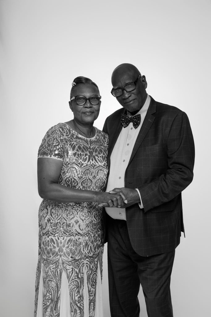 Wedding guest portrait on a white seamless backdrop at Andrea and Hugh's wedding (black and white)
