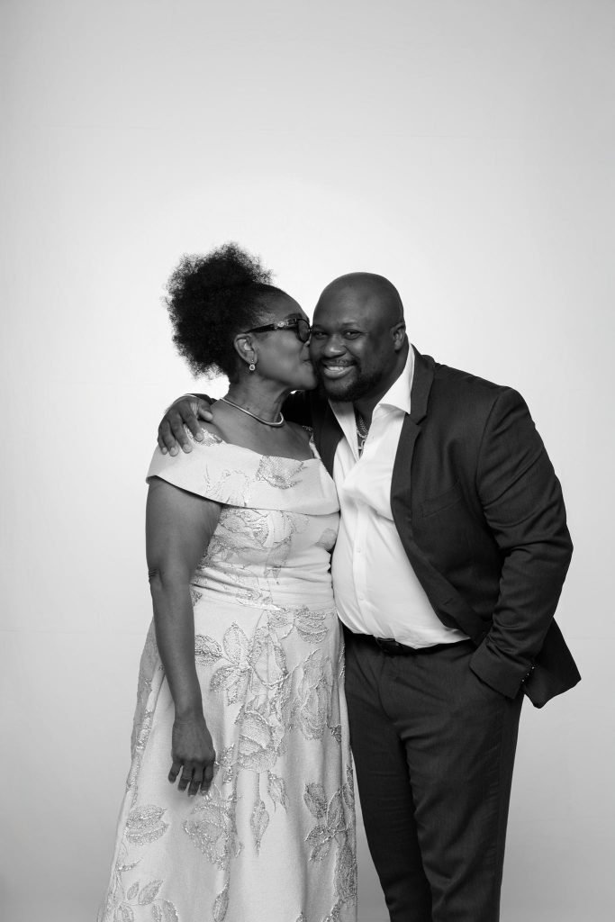 Wedding guest portrait on a white seamless backdrop at Andrea and Hugh's wedding (black and white)