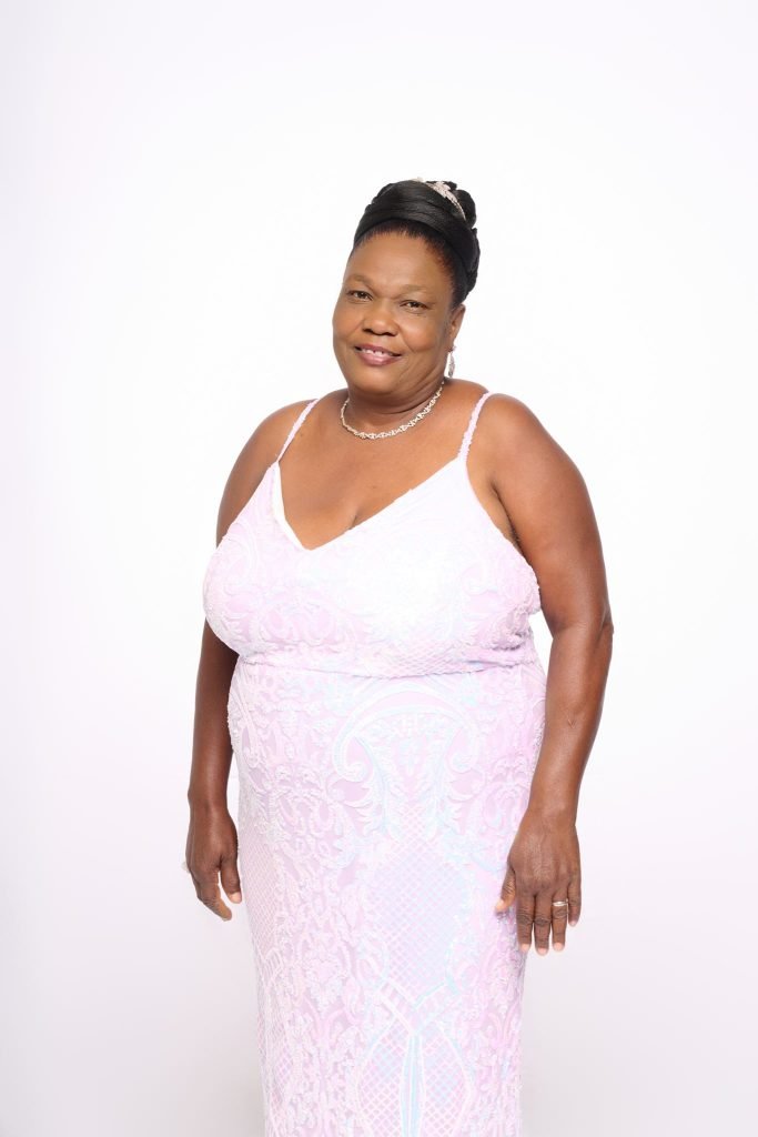 Wedding guest portrait on a white seamless backdrop at Andrea and Hugh's wedding