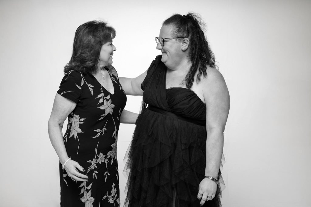 Wedding guest portrait on a white seamless backdrop at Andrea and Hugh's wedding (black and white)