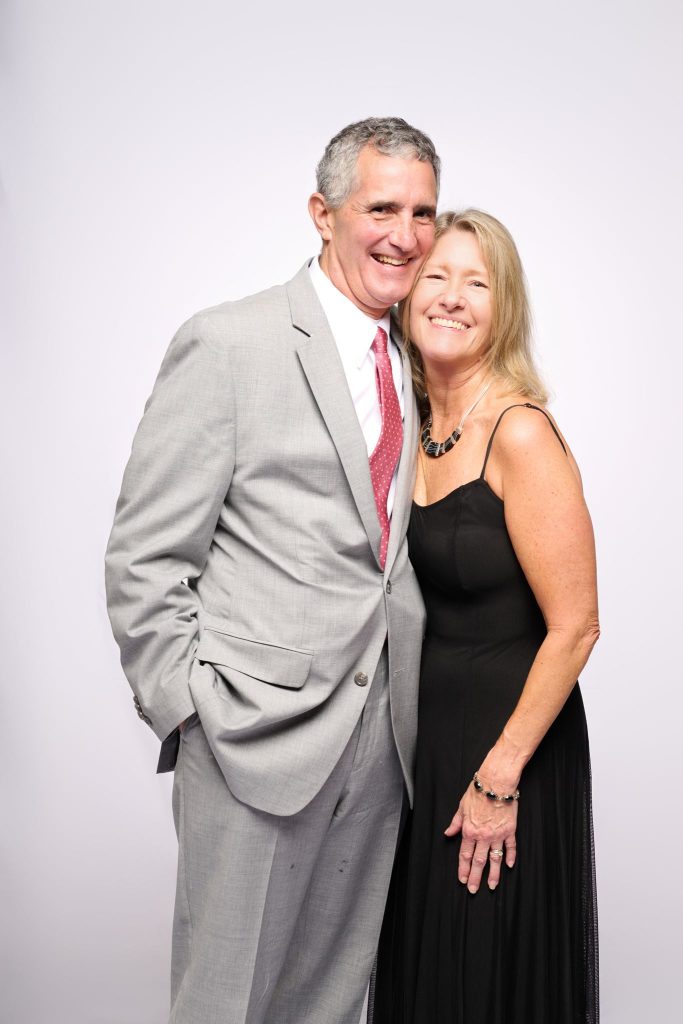 Wedding guest portrait on a white seamless backdrop at Andrea and Hugh's wedding