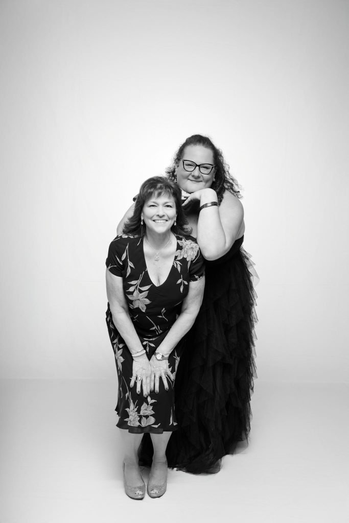 Wedding guest portrait on a white seamless backdrop at Andrea and Hugh's wedding (black and white)
