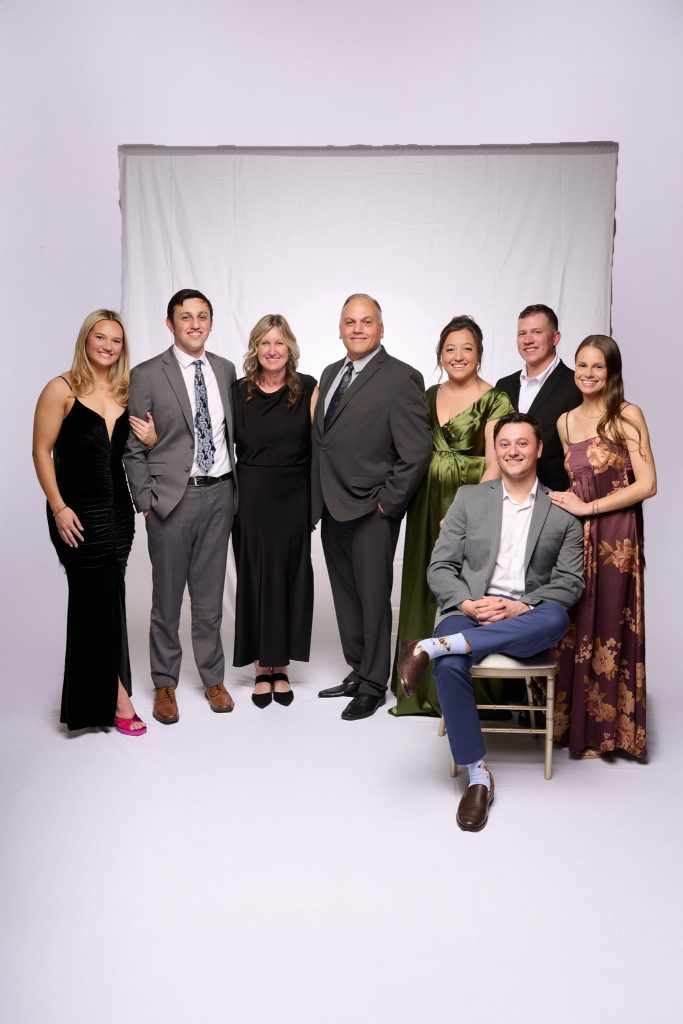 Wedding guest portrait on a white seamless backdrop at Andrea and Hugh's wedding