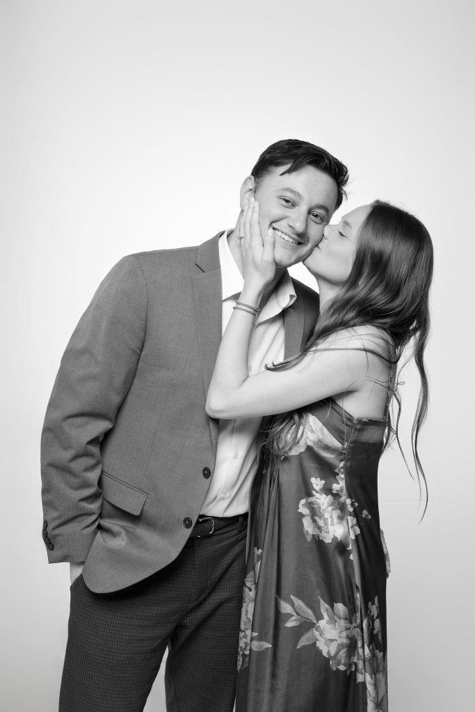 Wedding guest portrait on a white seamless backdrop at Andrea and Hugh's wedding (black and white)