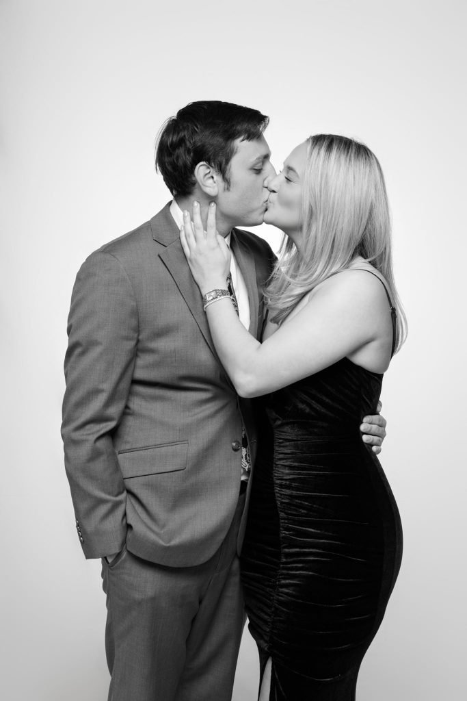 Wedding guest portrait on a white seamless backdrop at Andrea and Hugh's wedding (black and white)