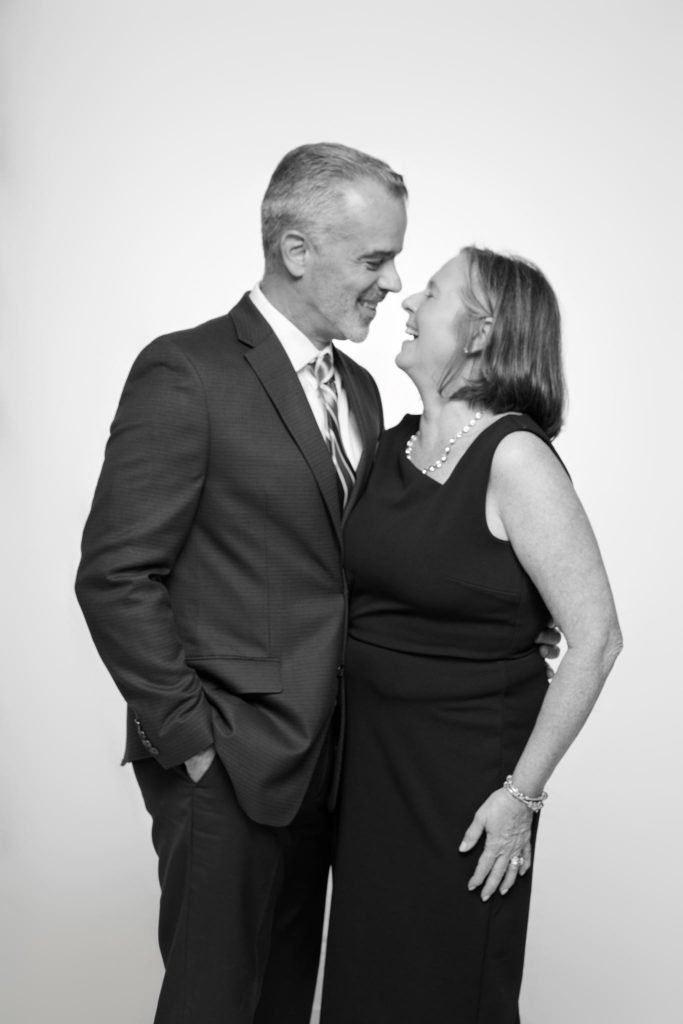 Wedding guest portrait on a white seamless backdrop at Andrea and Hugh's wedding (black and white)