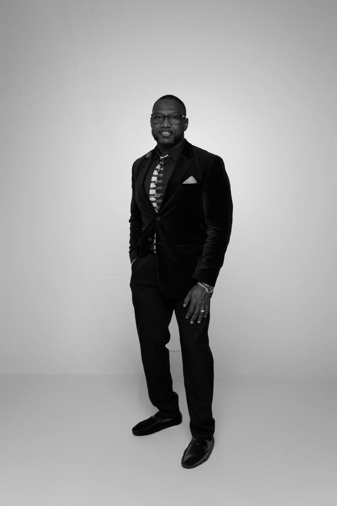 Wedding guest portrait on a white seamless backdrop at Andrea and Hugh's wedding (black and white)