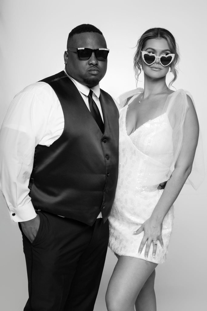 Wedding guest portrait on a white seamless backdrop at Andrea and Hugh's wedding (black and white)