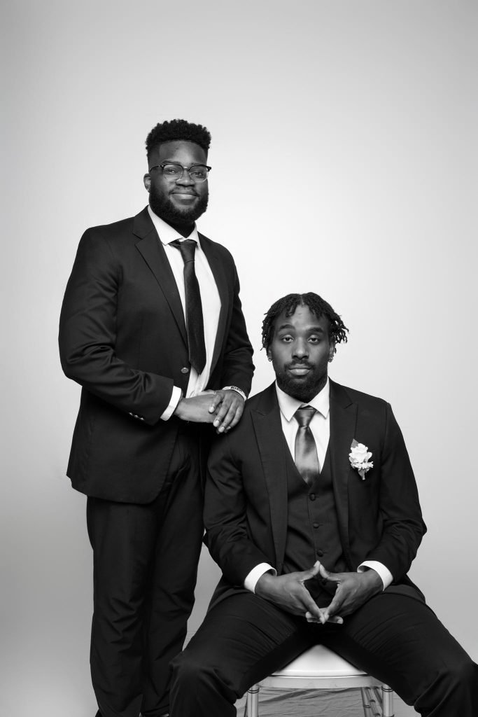 Wedding guest portrait on a white seamless backdrop at Andrea and Hugh's wedding (black and white)