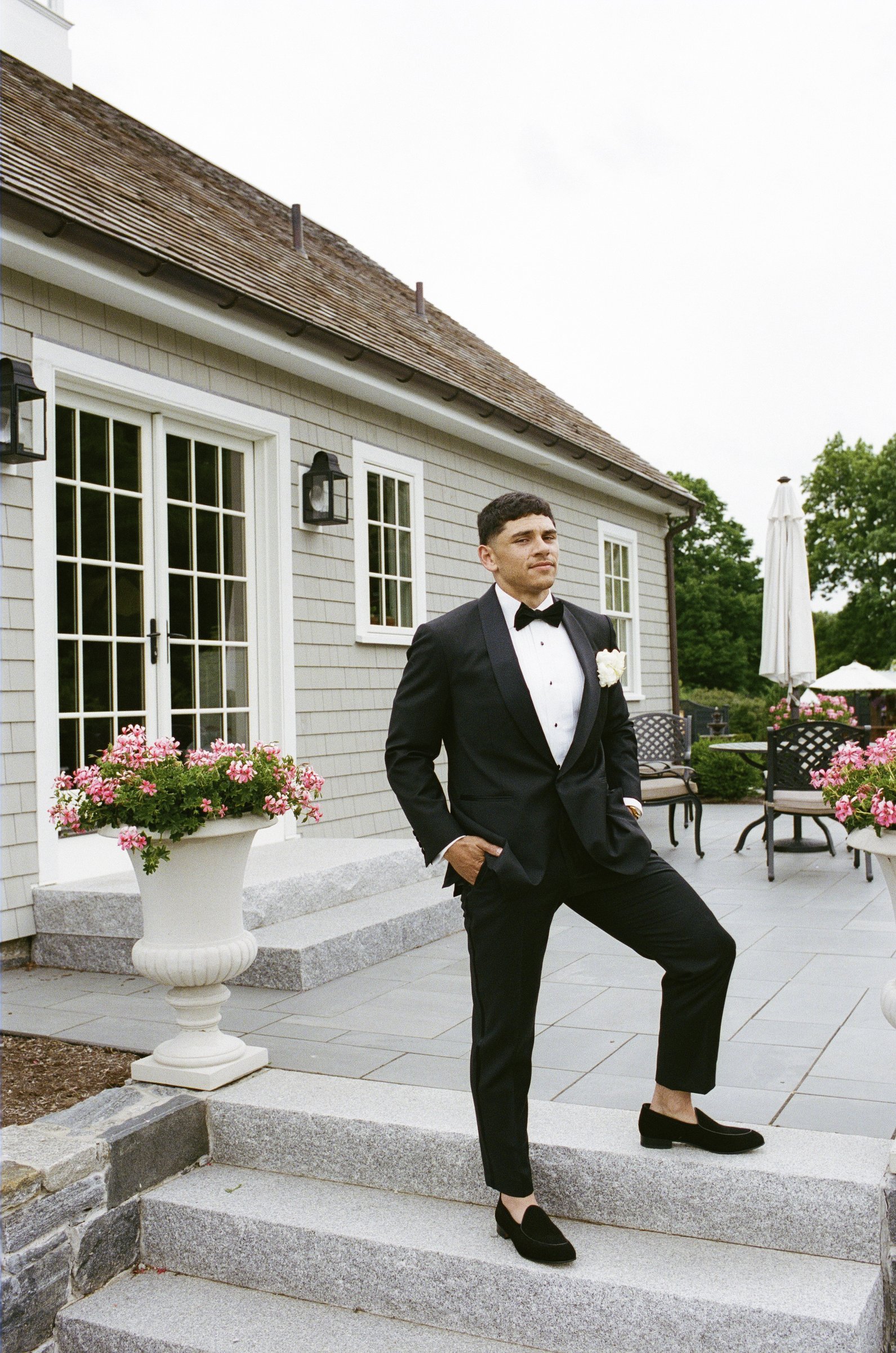 Avery on the steps of the farmhouse