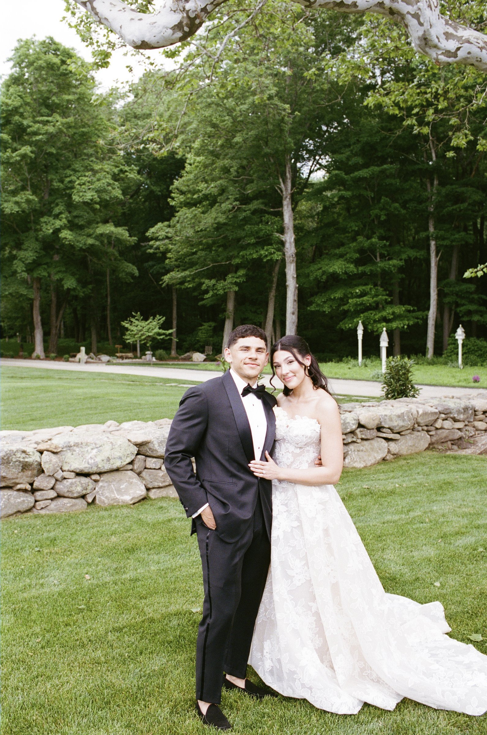 Kayla and Avery together by the stone wall