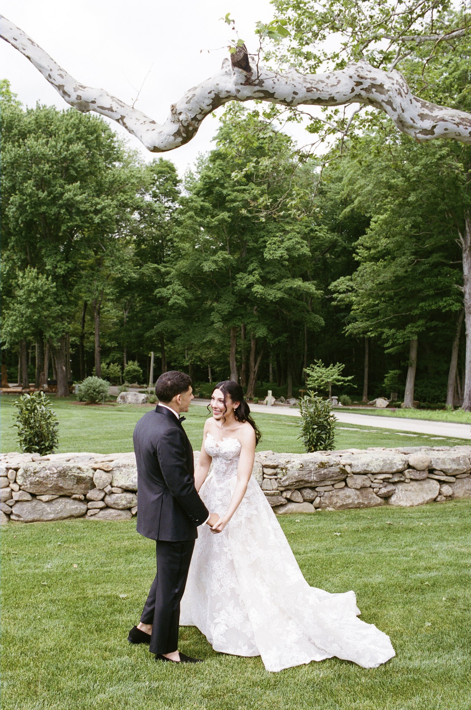 Kayla and Avery embracing on the lawn