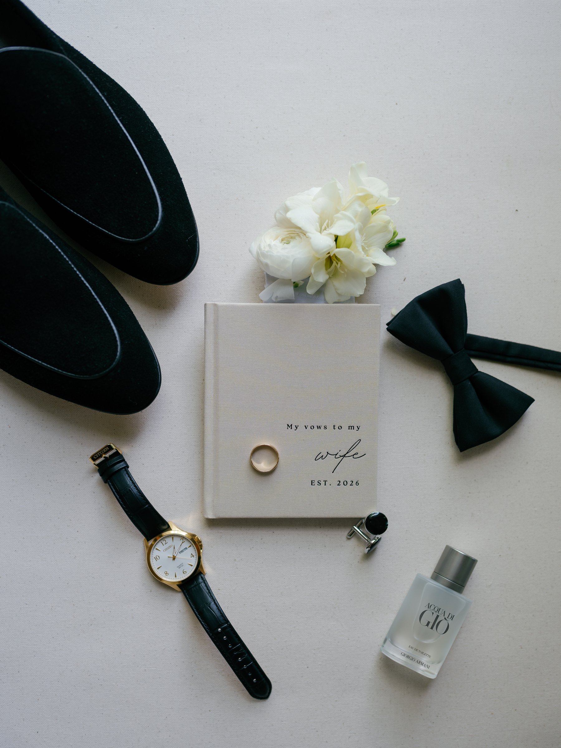 Avery's shoes, bow tie, watch, rings and vow book, "My vows to my wife"