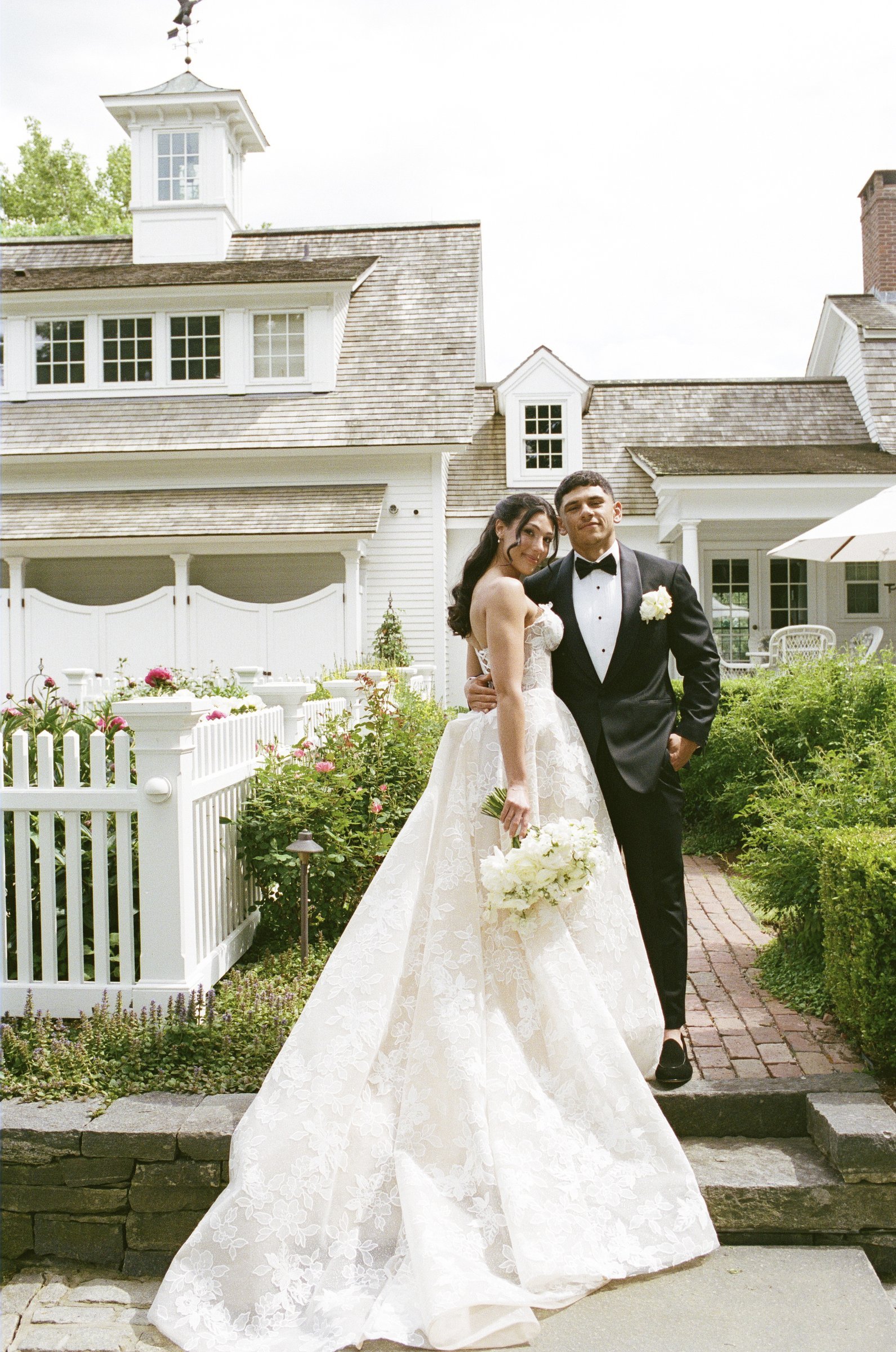 Kayla and Avery at the farmhouse gate