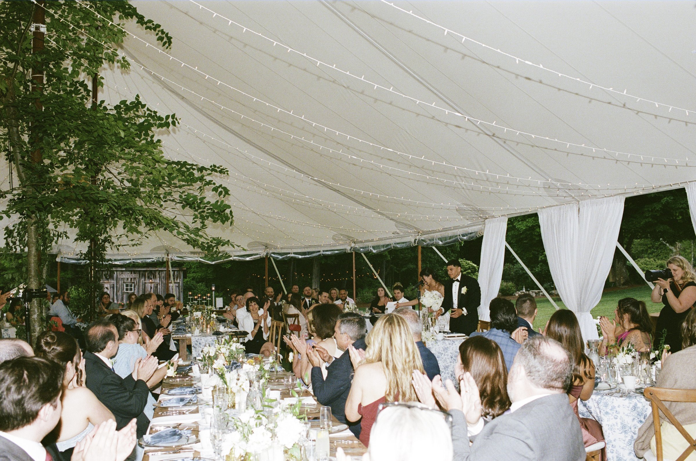 Guests at dinner under the tent