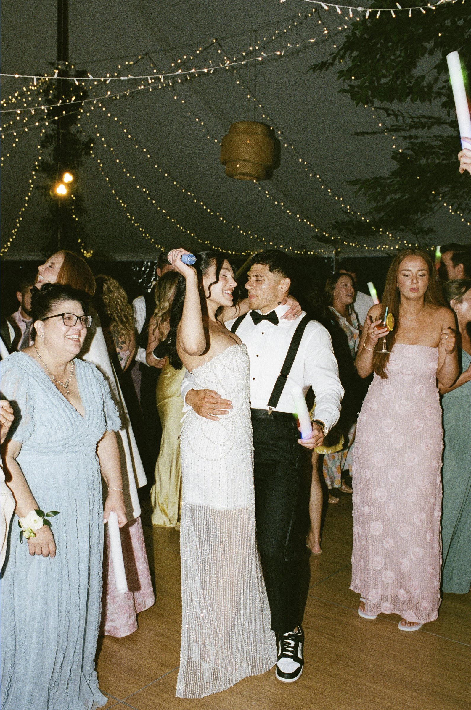 Guests dancing under the string lights