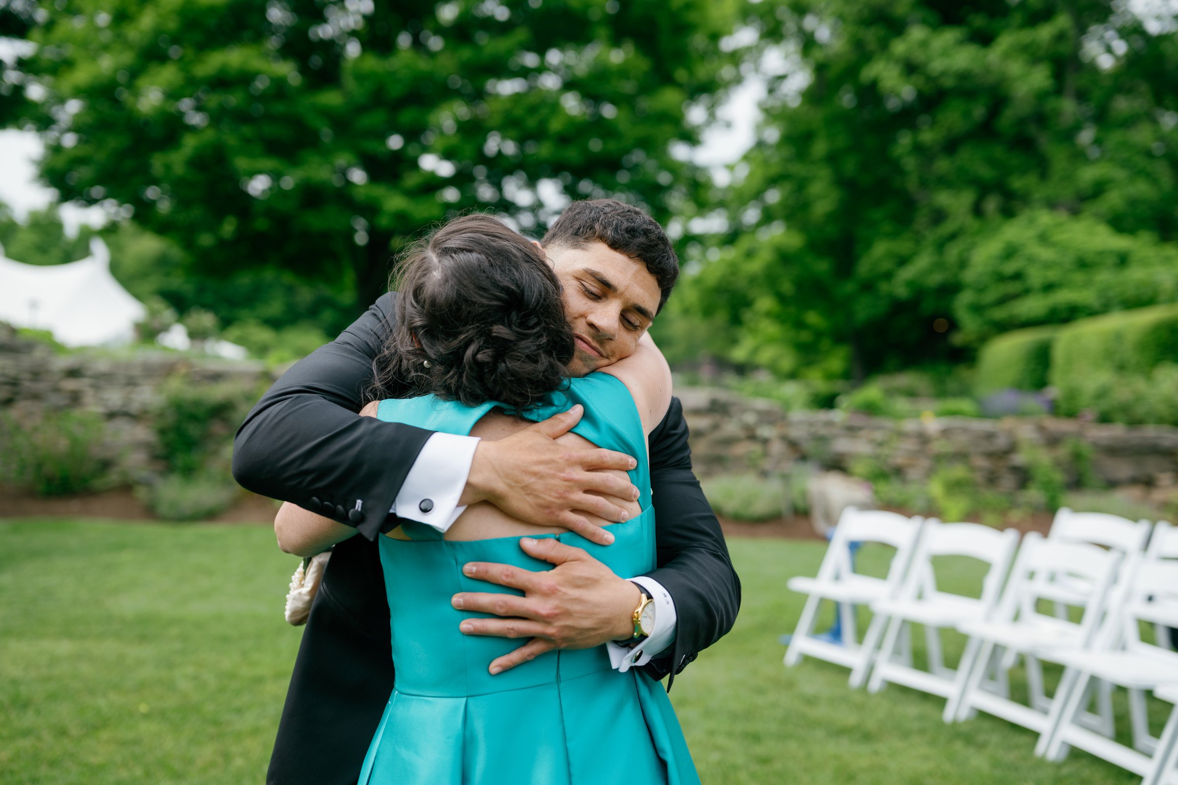 Avery hugging his mother before the ceremony