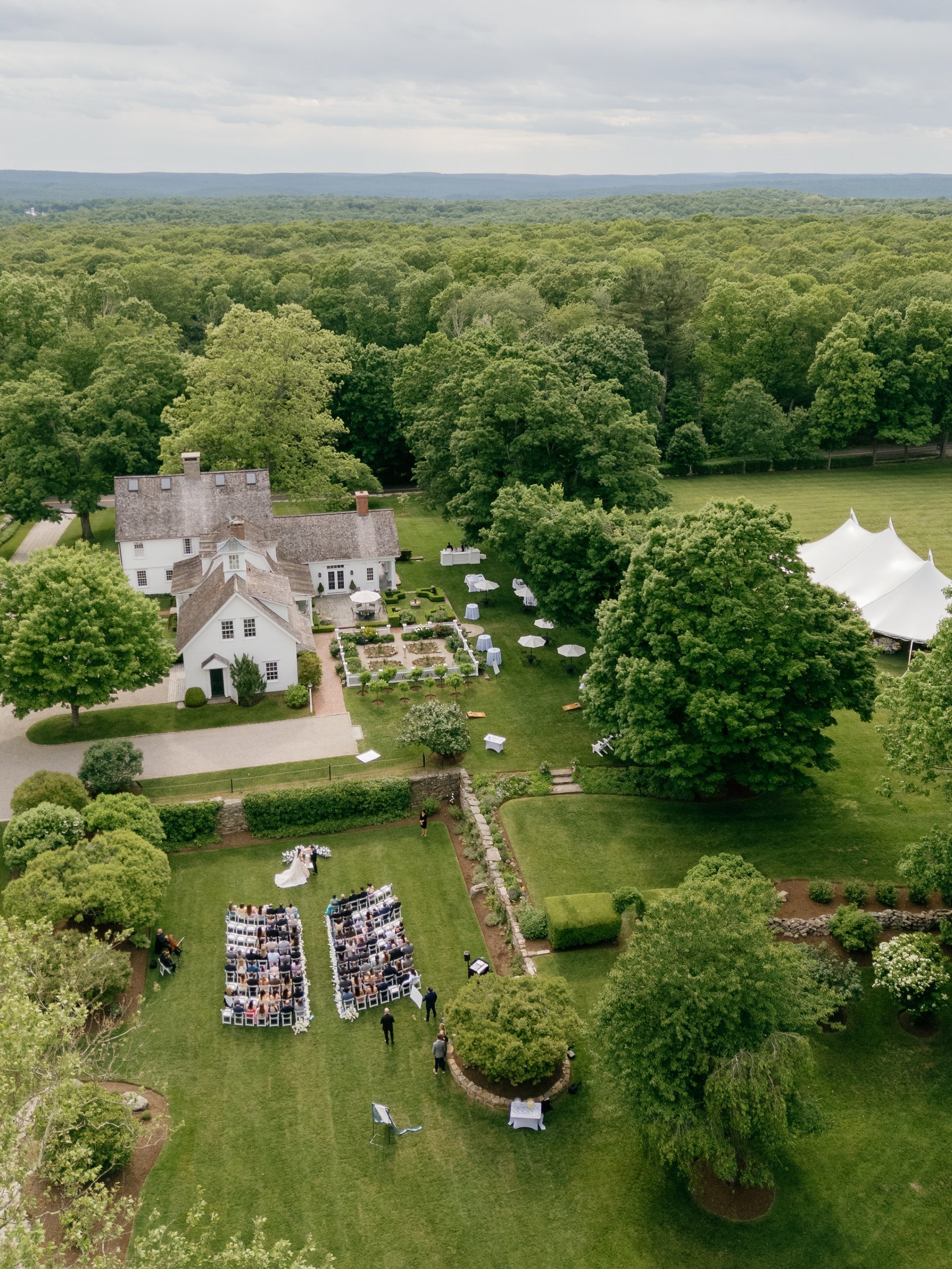 Smith Farm Gardens from above during the ceremony, with the tent in the meadow beyond
