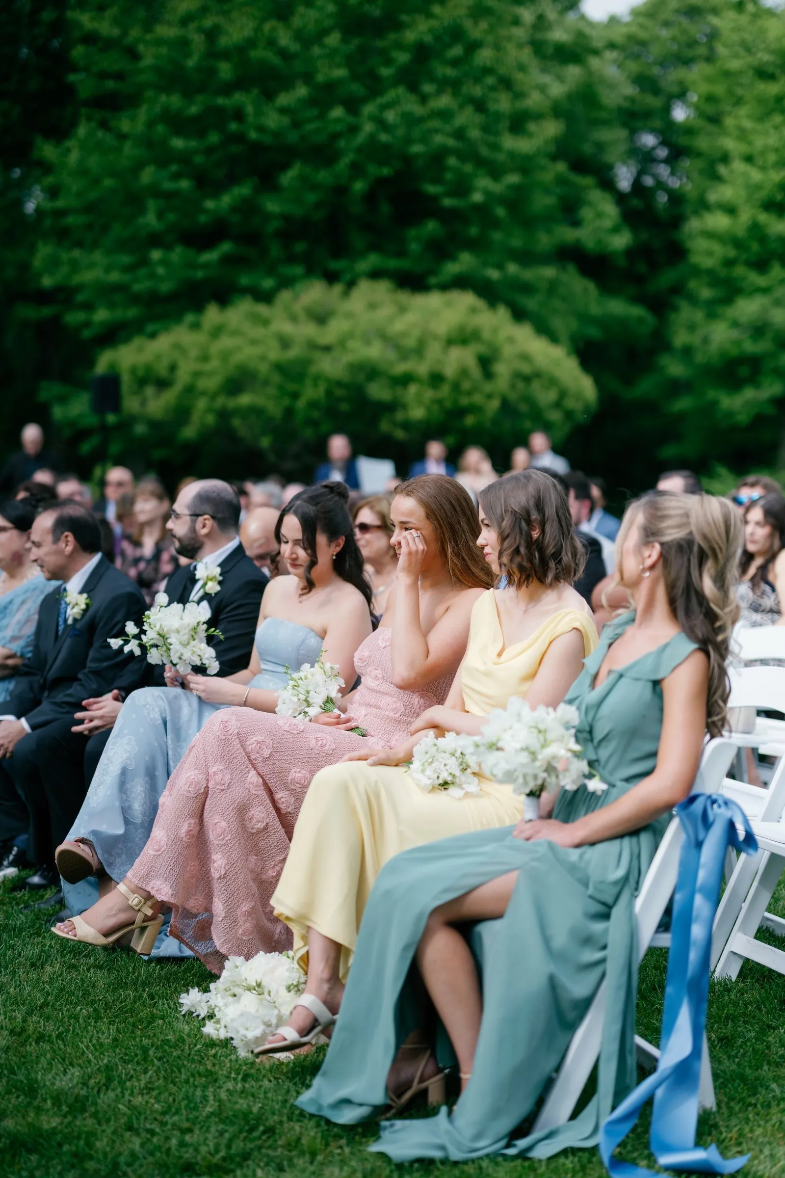 Kayla's bridesmaids watching the ceremony from the front row