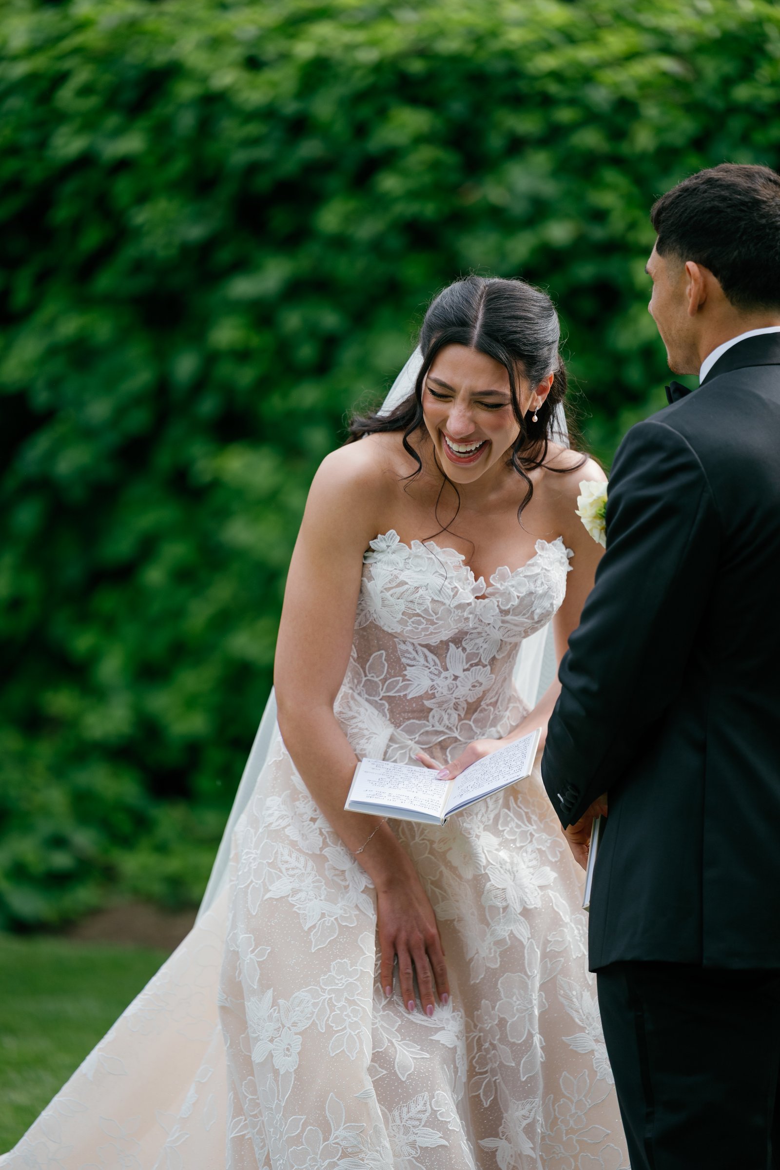 Kayla laughing over her vow book
