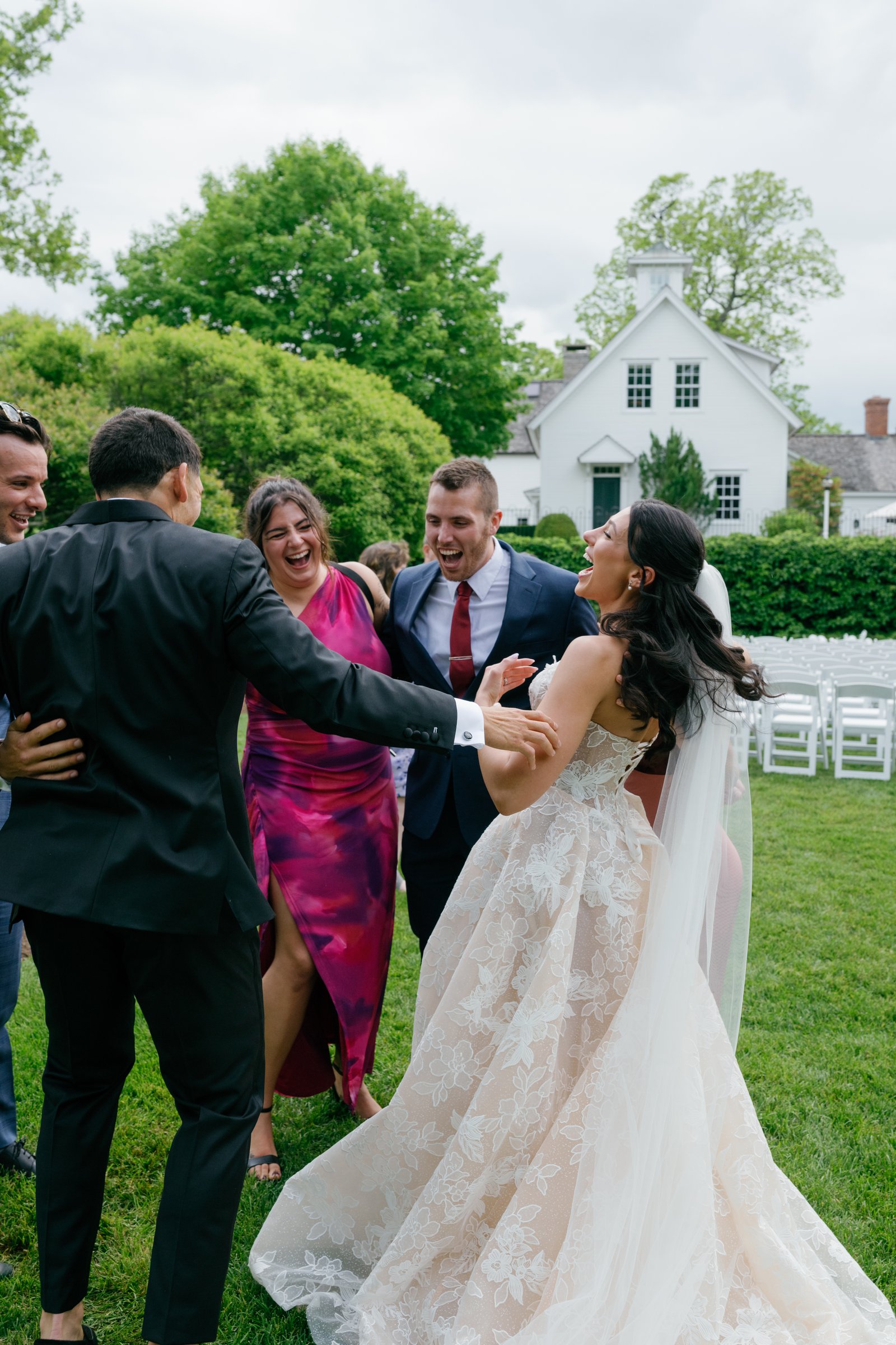 Guests greeting Kayla with hugs after the ceremony