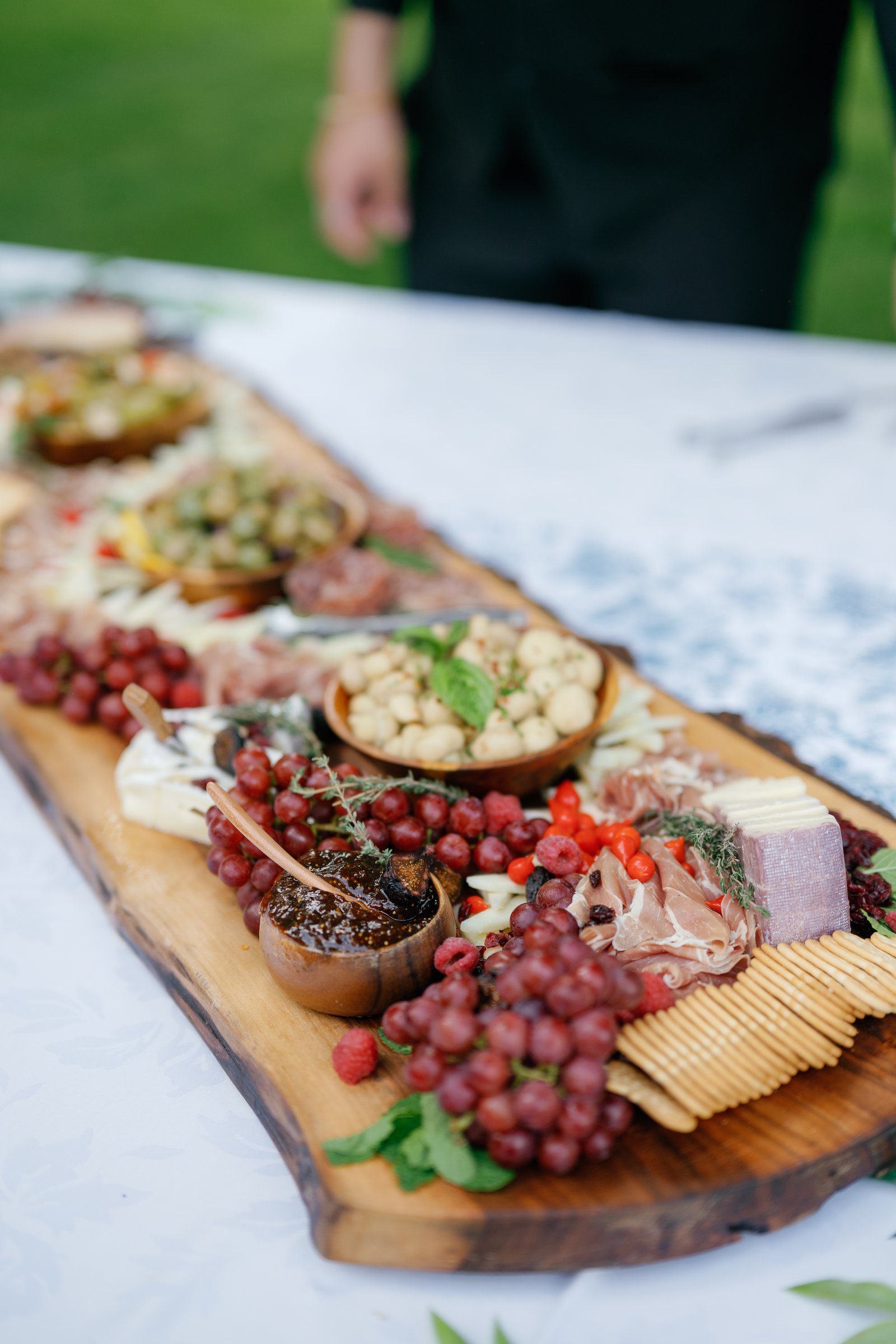A grazing board of cheese, fruit and charcuterie at cocktail hour