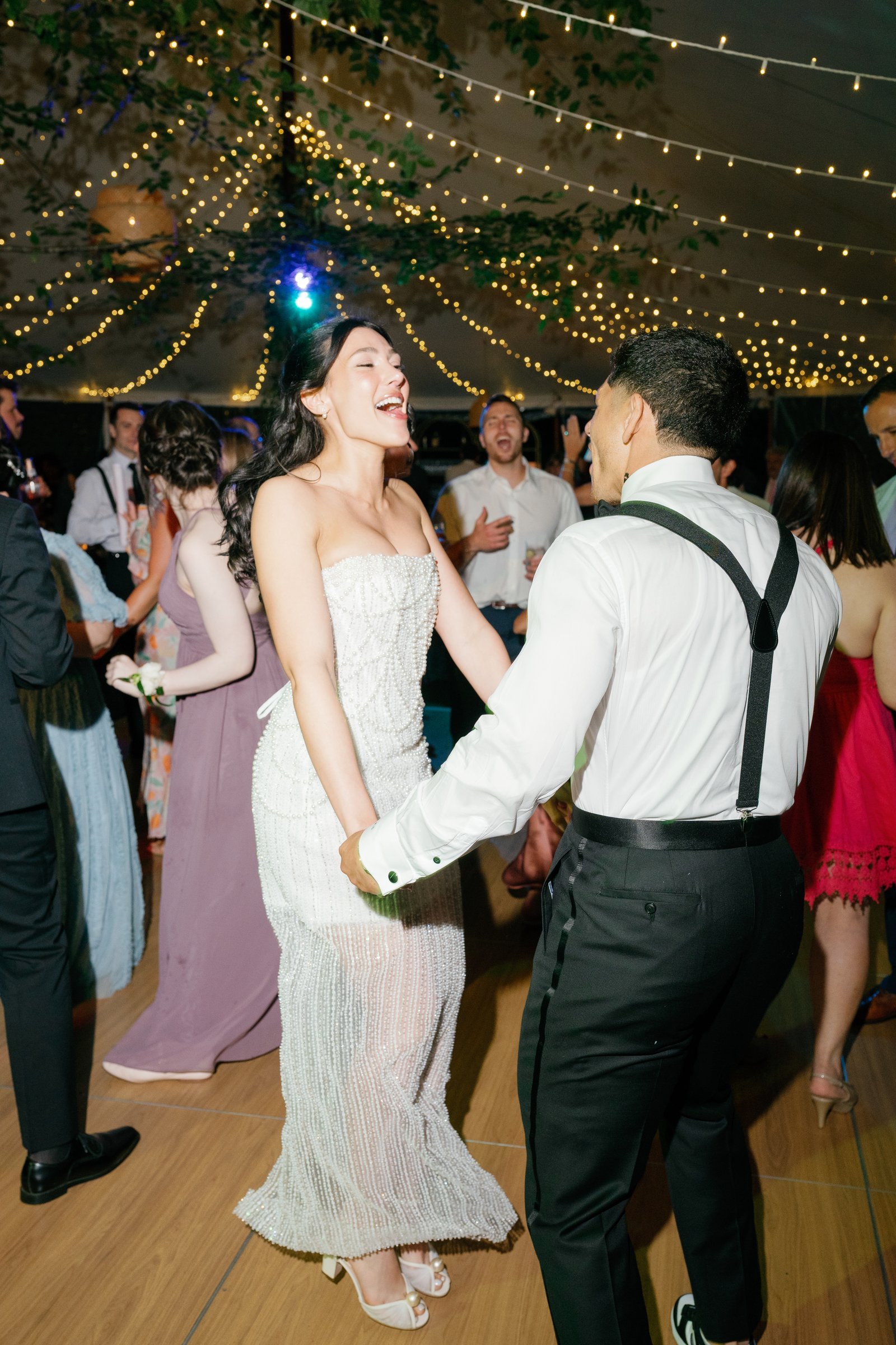 Kayla and Avery dancing face to face on the crowded floor