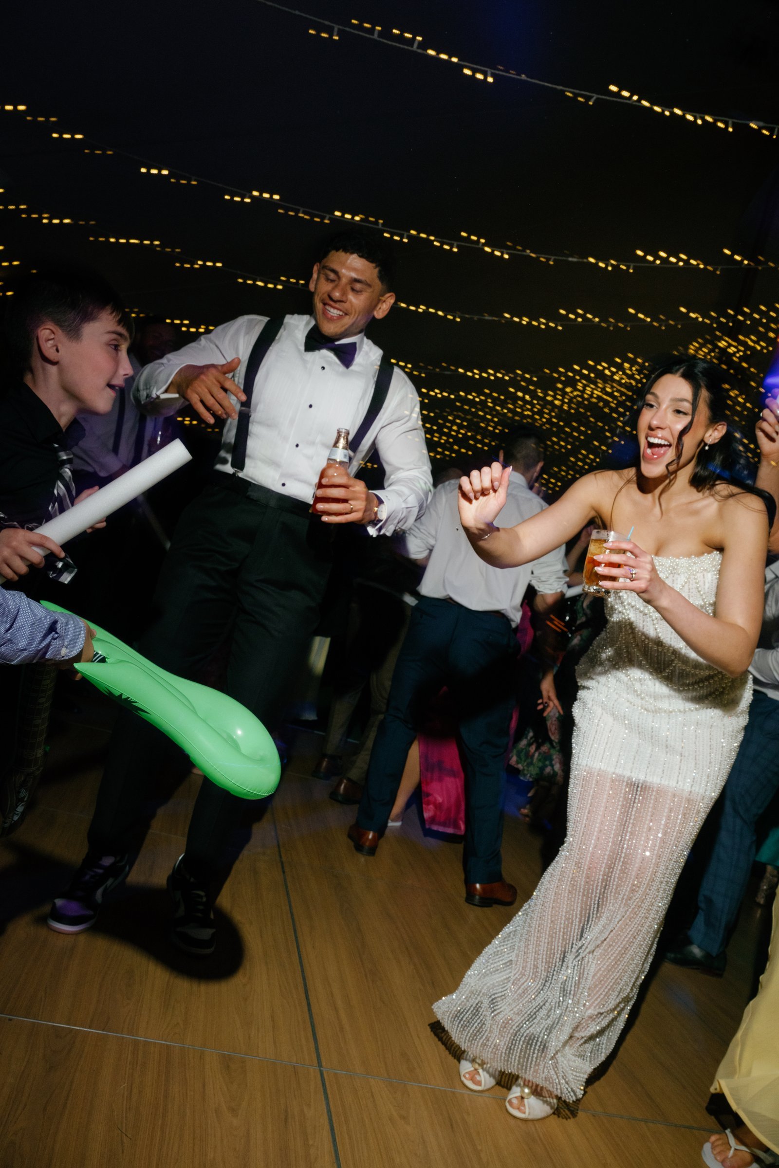 Kayla laughing as she dances beside Avery