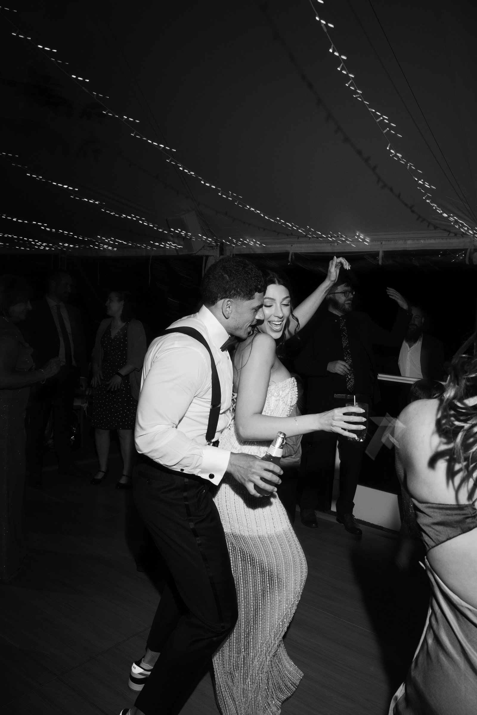 Kayla and Avery dancing close, in black and white