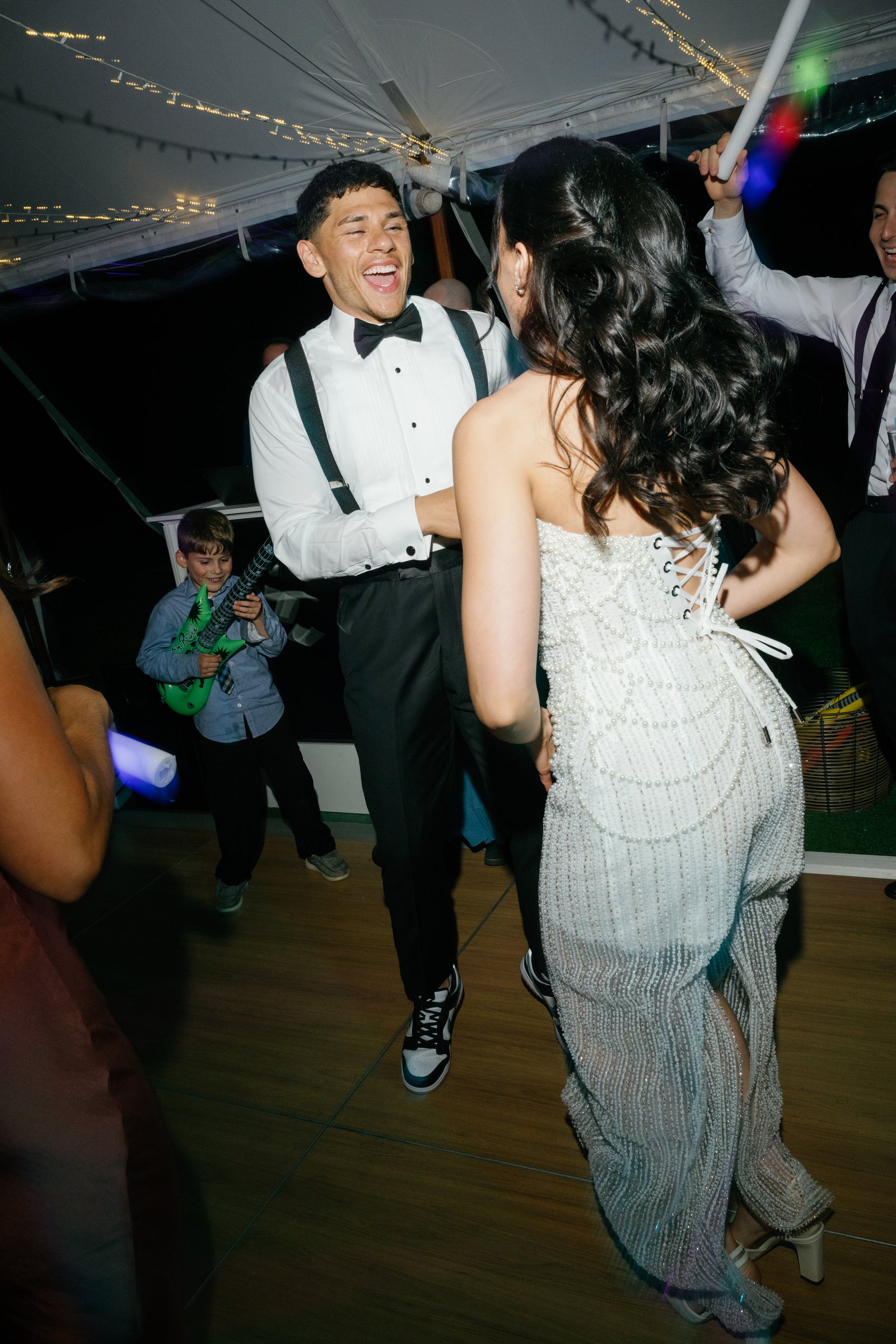 Avery laughing as he dances with Kayla