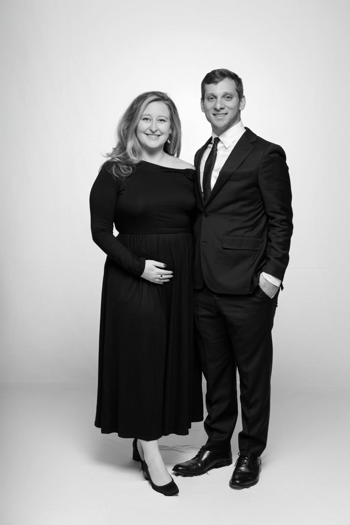 Wedding guest portrait on a white seamless backdrop, black and white