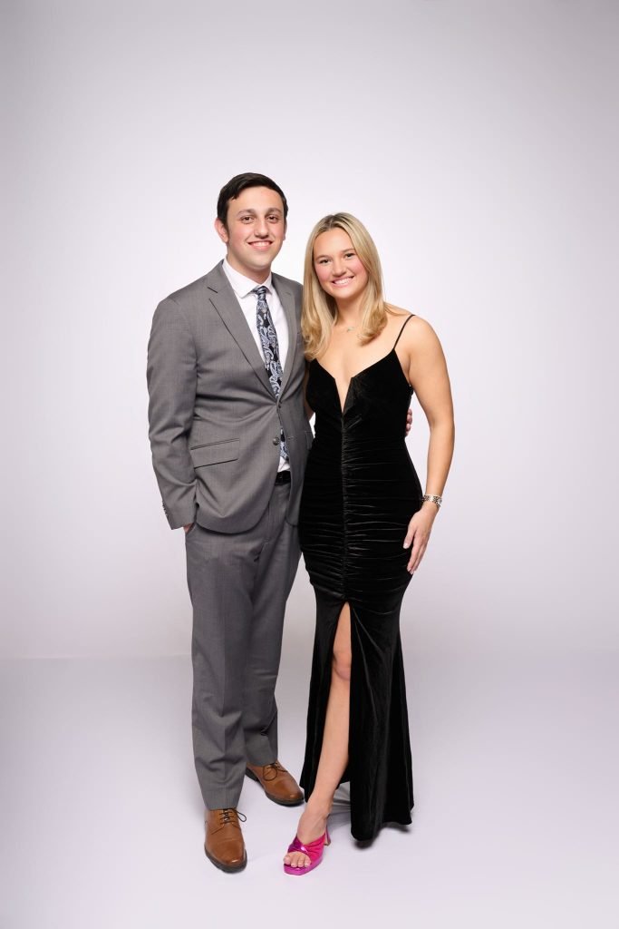 Wedding guest portrait on a white seamless backdrop