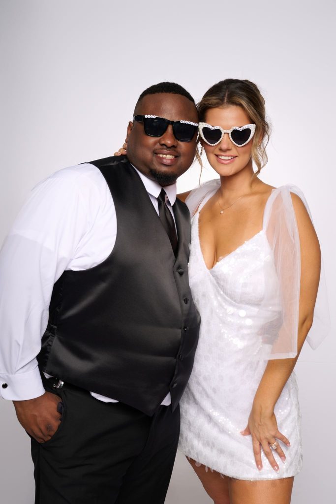 Wedding guest portrait on a white seamless backdrop