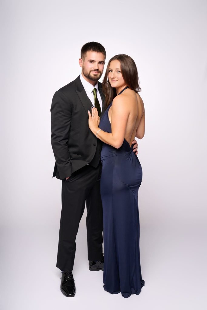 Wedding guest portrait on a white seamless backdrop