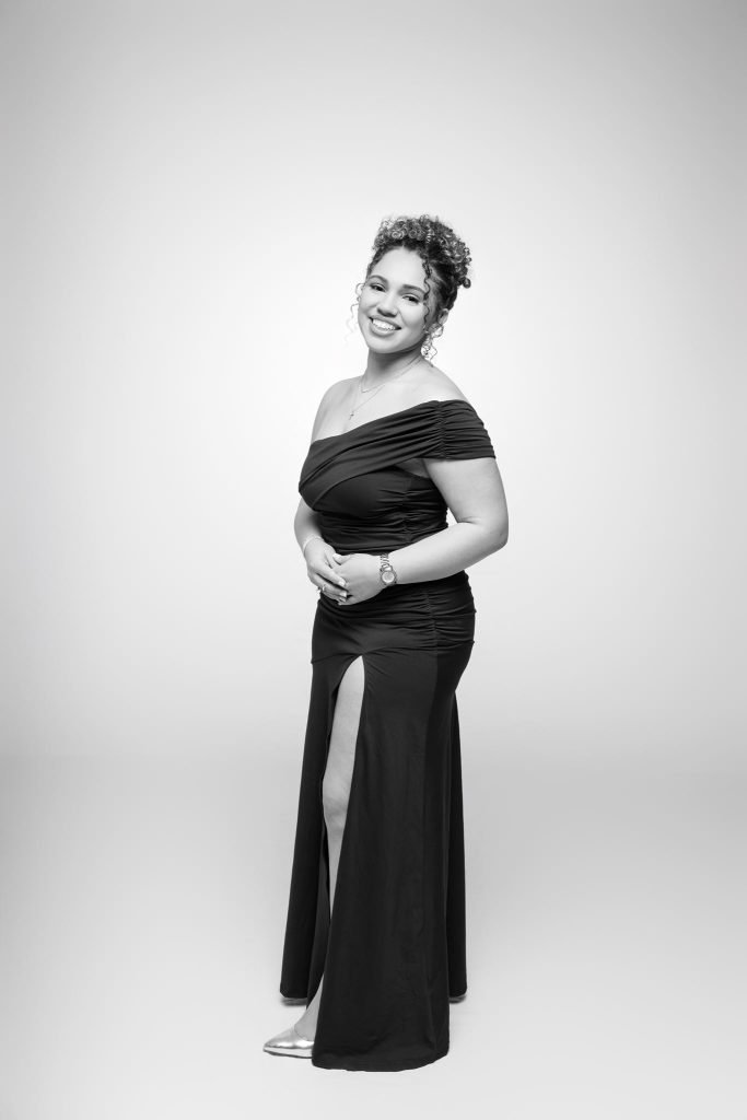 Wedding guest portrait on a white seamless backdrop, black and white